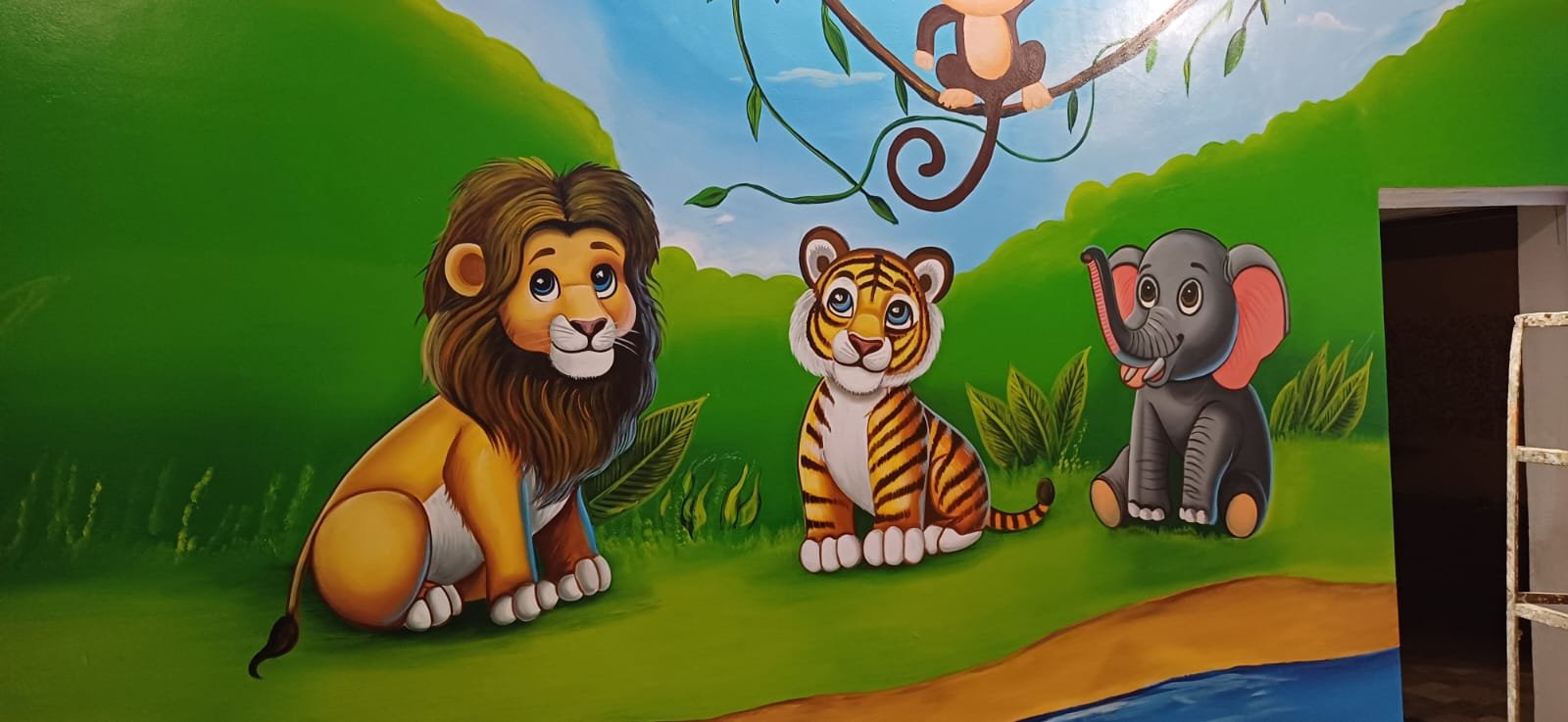 Colourful hand-painted lion, tiger and elephant jungle mural