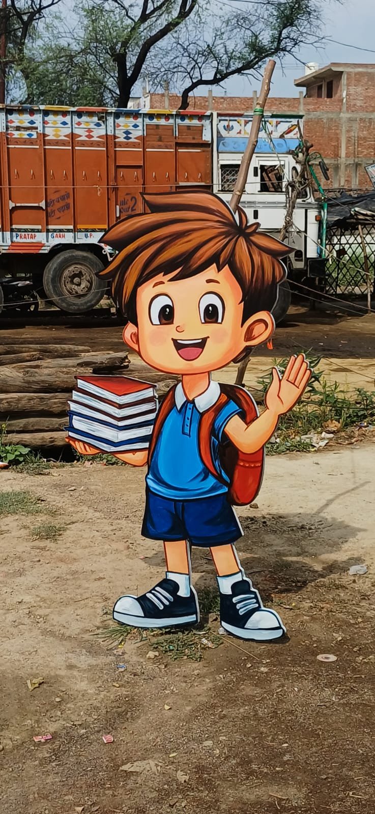 Large hand-painted cartoon schoolboy holding books and waving