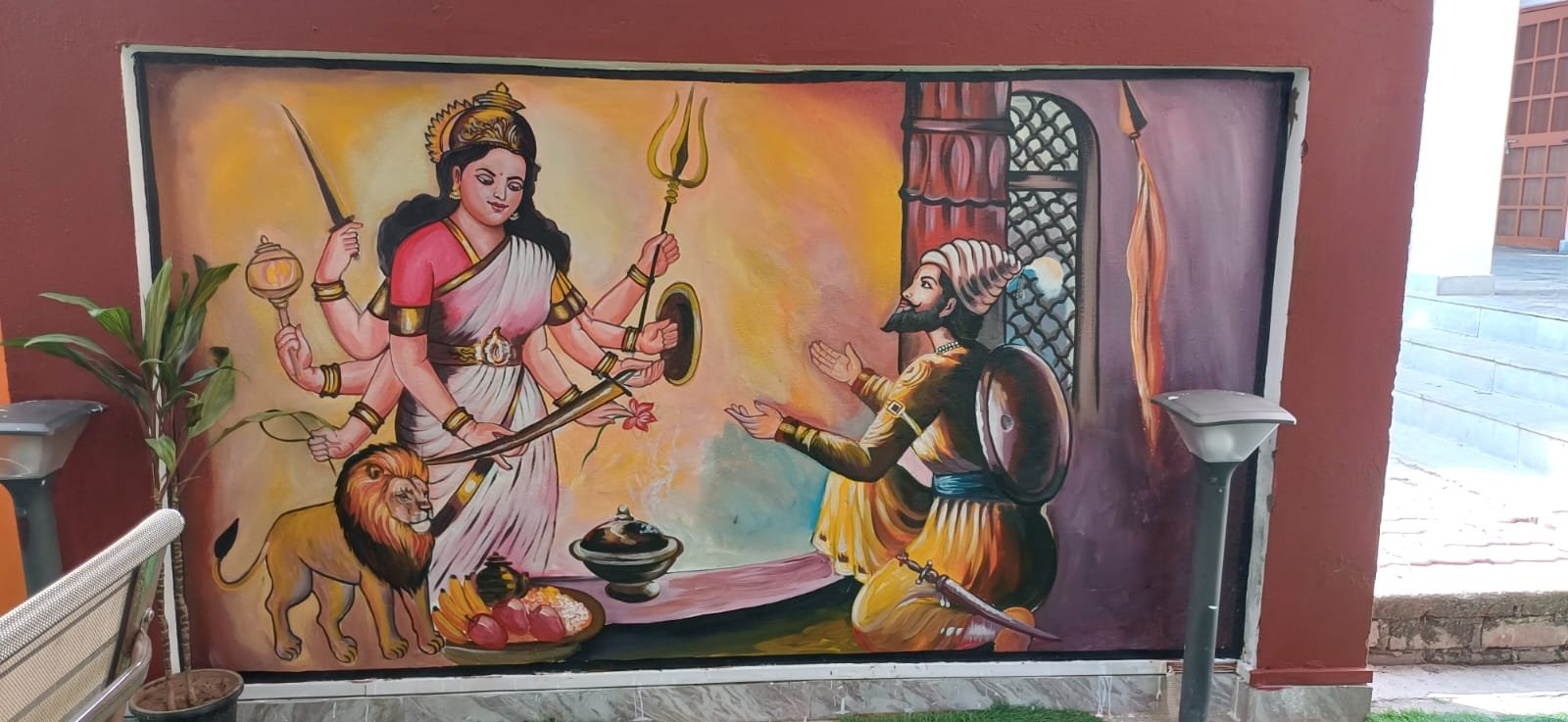 Hand-painted traditional Hindu goddess and devotional scene mural